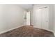 Bedroom with carpet flooring, double door closet and view into another room at 14663 Englert Aly, Orlando, FL 32827