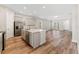 Open kitchen with island, stainless steel appliances at 14663 Englert Aly, Orlando, FL 32827