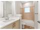 Clean bathroom with a tub, toilet, and modern vanity at 14663 Englert Aly, Orlando, FL 32827