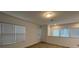 Bright bedroom with wood-look floors and window blinds at 14663 Englert Aly, Orlando, FL 32827
