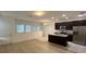 Modern kitchen with dark cabinets, granite counters, and stainless steel appliances at 14663 Englert Aly, Orlando, FL 32827