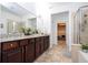 Elegant bathroom with double vanity and soaking tub at 6316 Miramonte Dr # 106, Orlando, FL 32835