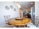 Bright dining area with wood table and chairs, offering a casual and inviting space at 6316 Miramonte Dr # 106, Orlando, FL 32835