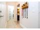 Clean hallway with tile floors and access to laundry and bathroom at 6316 Miramonte Dr # 106, Orlando, FL 32835