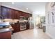 Well-equipped kitchen boasting stainless steel appliances and dark wood cabinetry at 6316 Miramonte Dr # 106, Orlando, FL 32835