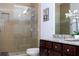 Bathroom with granite countertops, large shower, and double vanity at 6316 Miramonte Dr # 106, Orlando, FL 32835