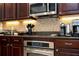 Close-up view of kitchen countertops and appliances, showing detail of design at 6316 Miramonte Dr # 106, Orlando, FL 32835