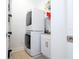 Laundry room with stacked washer and dryer, and a utility sink at 6316 Miramonte Dr # 106, Orlando, FL 32835