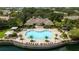 Community pool with surrounding patio and lounge chairs at 6316 Miramonte Dr # 106, Orlando, FL 32835