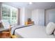 Comfortable bedroom with a king-size bed and hardwood floors at 6316 Miramonte Dr # 106, Orlando, FL 32835