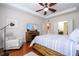 Bright bedroom featuring a comfortable sitting area and large TV at 6316 Miramonte Dr # 106, Orlando, FL 32835