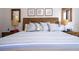 Main bedroom with wood floors, king-size bed and neutral decor at 6316 Miramonte Dr # 106, Orlando, FL 32835