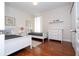 Charming bedroom with twin beds, hardwood floors, and ample closet space at 6316 Miramonte Dr # 106, Orlando, FL 32835