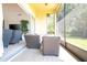 Relaxing screened porch with wicker furniture and access to backyard at 6316 Miramonte Dr # 106, Orlando, FL 32835