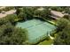 Two tennis courts nestled within a lush green community at 6316 Miramonte Dr # 106, Orlando, FL 32835