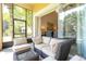 Screened porch with wicker furniture and view of the backyard at 6316 Miramonte Dr # 106, Orlando, FL 32835