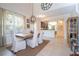 Open concept dining room with kitchen view, featuring a wooden table and neutral decor at 6316 Miramonte Dr # 106, Orlando, FL 32835