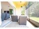 Relaxing screened porch with wicker furniture and access to backyard at 6316 Miramonte Dr # 106, Orlando, FL 32835