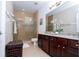 Bathroom with granite countertops, large shower, and double vanity at 6316 Miramonte Dr # 106, Orlando, FL 32835