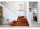 Elegant wooden staircase with white railings at 6316 Miramonte Dr # 106, Orlando, FL 32835
