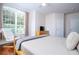 Comfortable bedroom with a king-size bed and hardwood floors at 6316 Miramonte Dr # 106, Orlando, FL 32835