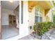 Inviting front entrance with a glass door and well-maintained landscaping at 6316 Miramonte Dr # 106, Orlando, FL 32835