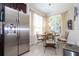 Stainless steel appliances and a breakfast nook in a well-lit kitchen area at 6316 Miramonte Dr # 106, Orlando, FL 32835