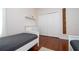 Bedroom with twin beds, hardwood floors, and closet at 6316 Miramonte Dr # 106, Orlando, FL 32835