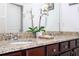 Elegant bathroom with double sinks, granite countertops, and ample storage at 6316 Miramonte Dr # 106, Orlando, FL 32835