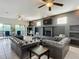 Bright living room featuring a fireplace, built-ins, and access to a deck at 226 Mitnik Dr, Deltona, FL 32738