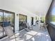 Relaxing screened porch with rocking chairs and view of the backyard at 226 Mitnik Dr, Deltona, FL 32738