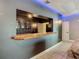 Basement bar with granite countertop and ample cabinet space at 226 Mitnik Dr, Deltona, FL 32738