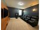 Home theater with leather recliners and large TV at 420 Lasso Dr, Kissimmee, FL 34747