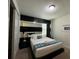 King-size bed with modern decor and mirror wall at 420 Lasso Dr, Kissimmee, FL 34747