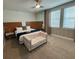 King-size bed, small sofa, and large windows at 420 Lasso Dr, Kissimmee, FL 34747