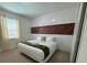 King-size bed, wall-mounted headboard, and modern decor at 420 Lasso Dr, Kissimmee, FL 34747