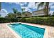 Inviting rectangular pool with a spa and brick patio at 420 Lasso Dr, Kissimmee, FL 34747