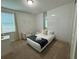 Bedroom with a queen-size bed and modern decor at 420 Lasso Dr, Kissimmee, FL 34747