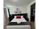 King-size bed, en-suite bathroom, and modern decor at 420 Lasso Dr, Kissimmee, FL 34747