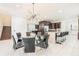 Elegant dining room with glass table and black chairs at 420 Lasso Dr, Kissimmee, FL 34747