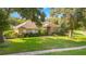Brick house front view, landscaping, and driveway at 1434 Hidden Meadow Way, Apopka, FL 32712