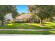 Brick house front view, landscaping, and driveway at 1434 Hidden Meadow Way, Apopka, FL 32712