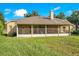 House exterior with screened porch and large backyard at 1434 Hidden Meadow Way, Apopka, FL 32712