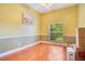 Spacious office with hardwood floors and large window providing natural light at 1434 Hidden Meadow Way, Apopka, FL 32712