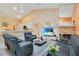 Open living area with vaulted ceiling, fireplace, and kitchen views at 1434 Hidden Meadow Way, Apopka, FL 32712