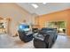 Living room with vaulted ceiling, fireplace, and leather furniture at 1434 Hidden Meadow Way, Apopka, FL 32712