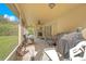 Spacious screened porch with seating area and grill at 1434 Hidden Meadow Way, Apopka, FL 32712