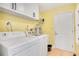 Laundry room with washer, dryer, and cabinets at 1434 Hidden Meadow Way, Apopka, FL 32712