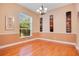 Bright dining room with hardwood floors and neutral wall colors at 1434 Hidden Meadow Way, Apopka, FL 32712