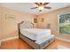 Bright bedroom with wood floors and a comfortable bed at 1434 Hidden Meadow Way, Apopka, FL 32712
